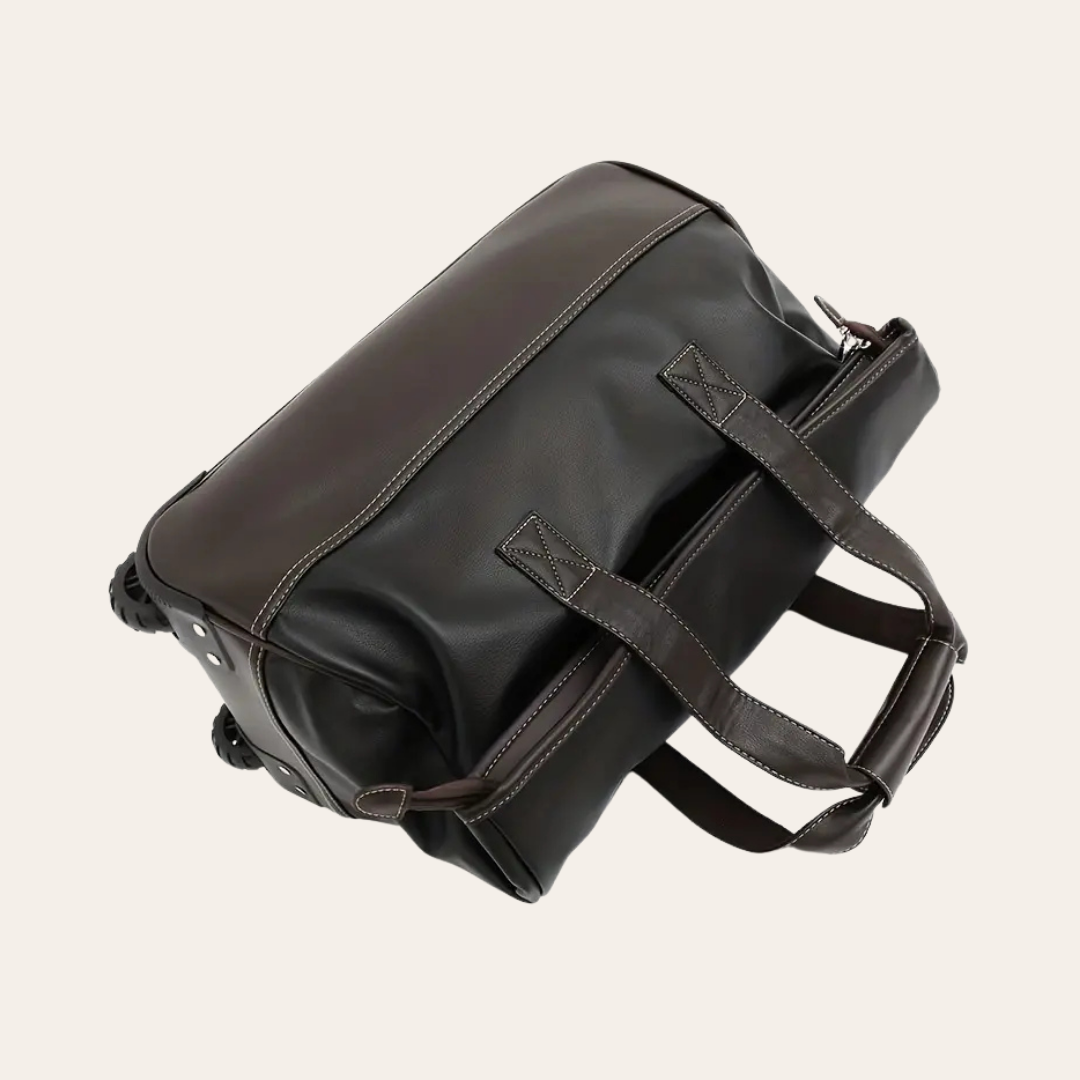 Grand sac de voyage sur roulettes en cuir.