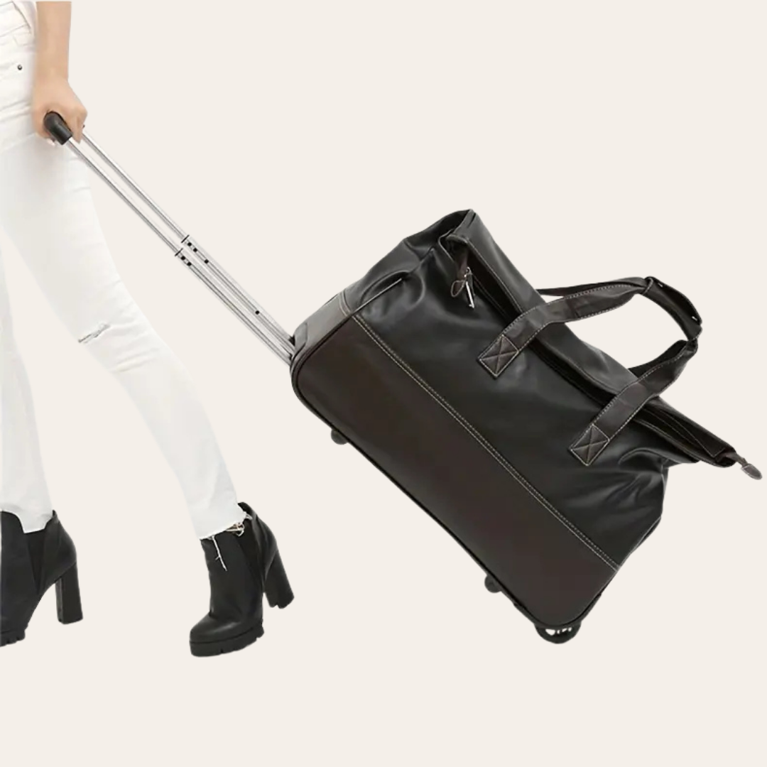Grand sac de voyage sur roulettes en cuir.