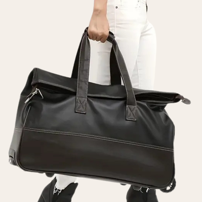Grand sac de voyage sur roulettes en cuir.